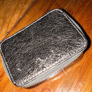 Coach metallic silver pill case